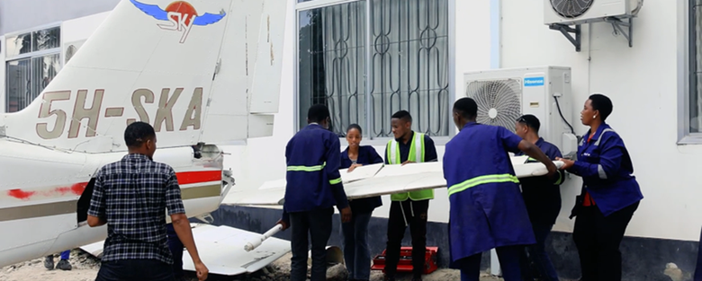 Students of aircraft maintenance engineering during a practical session at the National Institute of Transport in Tanzania. 